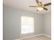 Bedroom with a window, fan, and light gray walls at 946 15Th St # 202, Daytona Beach, FL 32117