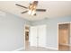 Bedroom with light gray walls, fan, closet, and attached bathroom and kitchen at 946 15Th St # 202, Daytona Beach, FL 32117