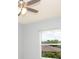 Comfortable bedroom with ceiling fan and view of greenery outside the window at 946 15Th St # 202, Daytona Beach, FL 32117