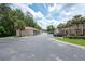Well-maintained building and parking, surrounded by lush palm trees and greenery at 946 15Th St # 202, Daytona Beach, FL 32117