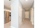 Hallway view leading to kitchen with stainless steel appliances and multiple rooms at 946 15Th St # 202, Daytona Beach, FL 32117