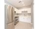 Bright kitchen with white cabinets, stainless appliances, and modern countertops at 946 15Th St # 202, Daytona Beach, FL 32117