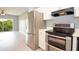 Updated kitchen with stainless appliances, including a fridge and double oven, perfect for cooking at 946 15Th St # 202, Daytona Beach, FL 32117