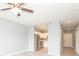 Spacious living room with ceiling fan flowing into kitchen with stainless steel appliances at 946 15Th St # 202, Daytona Beach, FL 32117