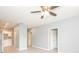 Open living area with modern ceiling fan and flowing into kitchen at 946 15Th St # 202, Daytona Beach, FL 32117