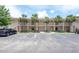 Condominium parking lot with palm trees, providing ample parking spaces for residents and visitors at 946 15Th St # 202, Daytona Beach, FL 32117