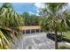 View of the parking lot surrounded by lush palm trees at 946 15Th St # 202, Daytona Beach, FL 32117
