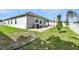 Well-maintained backyard with a patio and space for landscaping, ready for outdoor enjoyment at 303 Briarbrook Ln, Haines City, FL 33844