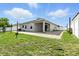 Spacious backyard with a covered patio perfect for relaxing or entertaining guests at 303 Briarbrook Ln, Haines City, FL 33844