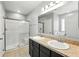 This bathroom features double sinks, granite countertops, and a separate shower and tub at 303 Briarbrook Ln, Haines City, FL 33844