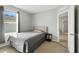 This secondary bedroom features natural light and neutral decor at 303 Briarbrook Ln, Haines City, FL 33844
