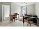 This room can serve as a flexible space, currently shown with musical instruments at 303 Briarbrook Ln, Haines City, FL 33844