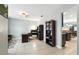 Bright home office features a modern desk setup and a view into the adjacent living spaces at 303 Briarbrook Ln, Haines City, FL 33844