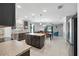 Open concept kitchen with stainless steel appliances and a spacious island perfect for entertaining at 303 Briarbrook Ln, Haines City, FL 33844