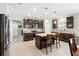 Inviting kitchen with island, stainless appliances and coordinated backsplash and countertops at 303 Briarbrook Ln, Haines City, FL 33844