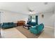 Neutral living area showcasing a large area rug, furniture, and bright colors at 303 Briarbrook Ln, Haines City, FL 33844