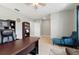 This office features built-in shelving, stylish decor, and plenty of natural light at 303 Briarbrook Ln, Haines City, FL 33844