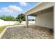 Covered patio with brick flooring, ideal for enjoying the outdoors in any weather at 303 Briarbrook Ln, Haines City, FL 33844