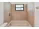 Bathroom with a bathtub and ceramic tile at 5455 Pinetrail Way, Orlando, FL 32822
