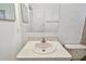 A view of a bathroom with a white sink and vanity at 5455 Pinetrail Way, Orlando, FL 32822