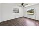 Bright bedroom with two windows offering natural light at 5455 Pinetrail Way, Orlando, FL 32822