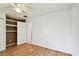 Bright bedroom features hardwood floors, ceiling fan, and a closet at 5455 Pinetrail Way, Orlando, FL 32822