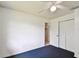 A bright bedroom featuring carpet and a closet with double doors at 5455 Pinetrail Way, Orlando, FL 32822