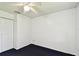 A bright bedroom featuring carpet and a closet with double doors at 5455 Pinetrail Way, Orlando, FL 32822