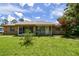Charming single-story brick home with a well-maintained lawn and front porch at 5455 Pinetrail Way, Orlando, FL 32822