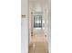 Hallway with tile floor and neutral paint at 5455 Pinetrail Way, Orlando, FL 32822