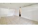 Spacious living room featuring tile floors, recessed lighting, and open floor plan at 5455 Pinetrail Way, Orlando, FL 32822