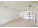 Expansive living room with tile floors, neutral palette, and ample natural light at 5455 Pinetrail Way, Orlando, FL 32822