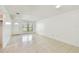 Spacious living room with tile floors, a ceiling light, and a large window at 5455 Pinetrail Way, Orlando, FL 32822
