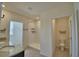 Bright bathroom features double vanity, step-in shower, and toilet room for a luxurious and private experience at 2005 Carnostie Rd, Winter Haven, FL 33884