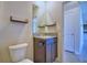 Bathroom featuring granite countertop, vanity, and updated fixtures at 2005 Carnostie Rd, Winter Haven, FL 33884