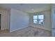 Bright bedroom featuring a window and a closet, offering comfort and functionality at 2005 Carnostie Rd, Winter Haven, FL 33884