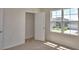 Bedroom featuring a large window overlooking the property, as well as a walk-in closet at 2005 Carnostie Rd, Winter Haven, FL 33884