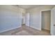 Cozy bedroom with neutral carpet and a convenient closet space at 2005 Carnostie Rd, Winter Haven, FL 33884