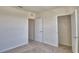 Bedroom featuring closet and an adjacent interior door leading to additional living spaces at 2005 Carnostie Rd, Winter Haven, FL 33884
