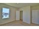 Bedroom featuring a closet and large window at 2005 Carnostie Rd, Winter Haven, FL 33884