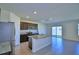 Spacious kitchen featuring stainless steel appliances, granite countertops, and tile flooring throughout at 2005 Carnostie Rd, Winter Haven, FL 33884