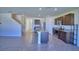 Well-lit kitchen boasting stainless steel appliances, granite countertops, with a staircase nearby at 2005 Carnostie Rd, Winter Haven, FL 33884