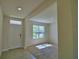 Inviting living room featuring tile entryway and a large window providing natural light and outdoor views at 2005 Carnostie Rd, Winter Haven, FL 33884