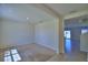 Bright living room with neutral carpet and a view into the dining area with neutral tile flooring at 2005 Carnostie Rd, Winter Haven, FL 33884