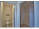 Toilet Room with tile floor and neutral paint allows for added privacy in this home's thoughtfully designed bathroom at 2005 Carnostie Rd, Winter Haven, FL 33884