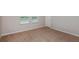 Bright, carpeted bedroom with large windows for scenic exterior views and natural lighting at 738 Ambleside Dr, Haines City, FL 33844