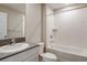 Bathroom featuring a bathtub and shower, a sink, and white cabinetry at 762 Ambleside Dr, Haines City, FL 33844