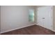 Bedroom featuring a double-door closet and a window with blinds at 762 Ambleside Dr, Haines City, FL 33844