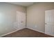 Bedroom with a double-door closet and a door with neutral walls and carpeting at 762 Ambleside Dr, Haines City, FL 33844