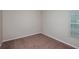 Bedroom with a window with blinds with neutral walls and carpeting at 762 Ambleside Dr, Haines City, FL 33844